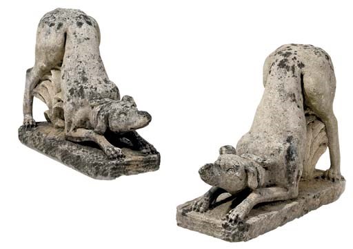 A PAIR OF STONE COMPOSITE FIGURES OF HOUNDS