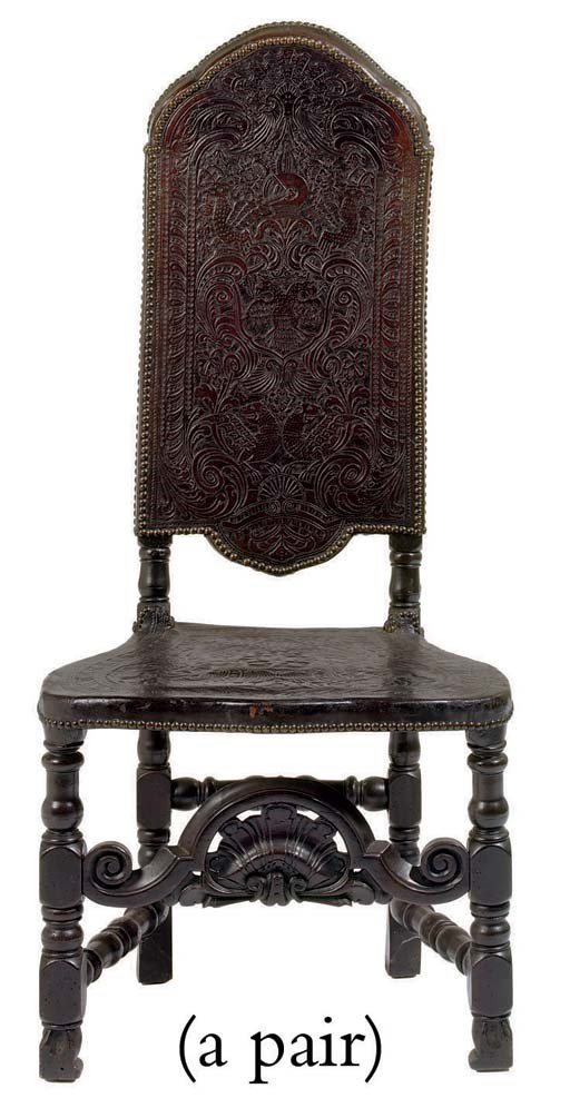 A PAIR OF SPANISH BAROQUE TOOLED-LEATHER AND EBONIZED SIDE CHAIRS