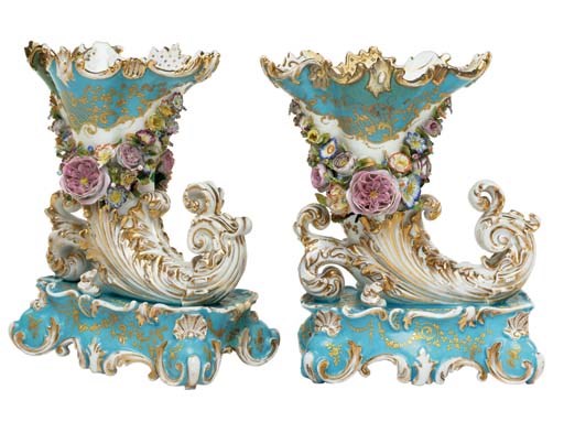 A PAIR OF JACOB PETIT PORCELAIN BLUE GROUND FLOWER-ENCRUSTED CORNUCOPIA VASES ON FIXED STANDS