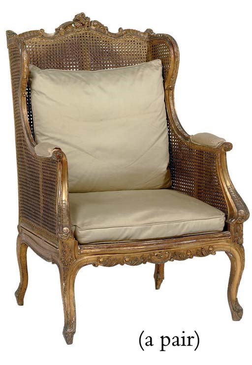 A PAIR OF FRENCH GILT-WOOD AND CANED BERGERES AUX OREILLES