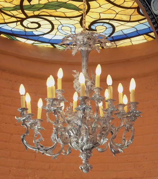 A FRENCH SILVERED METAL EIGHTEEN LIGHT CHANDELIER