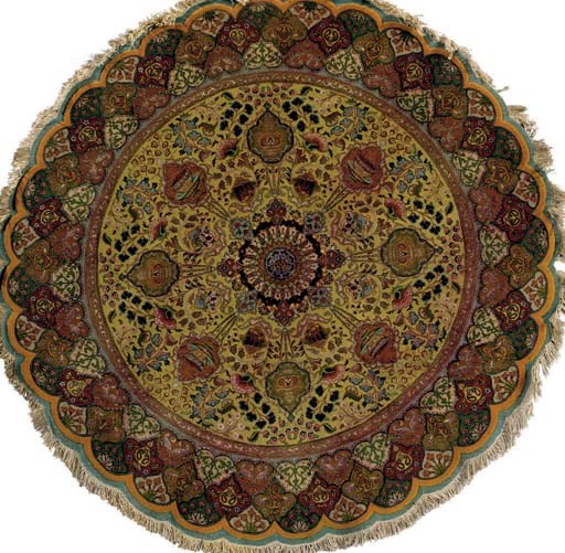 A ROUND SILK QUM RUG
