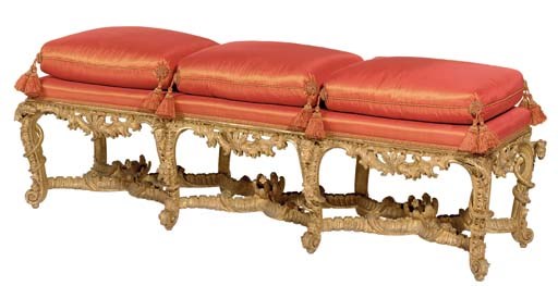 AN EARLY LOUIS XV GILTWOOD BANQUETTE
