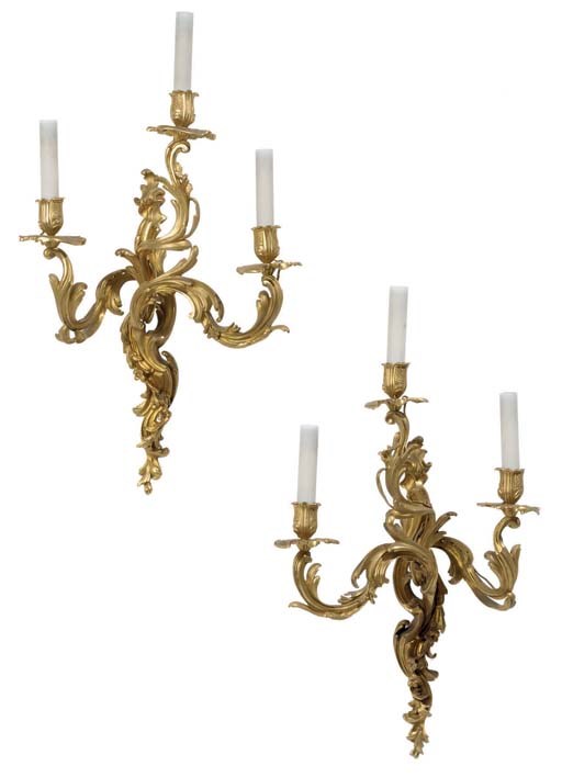 A pair of Louis XV style ormolu three-light wall appliques