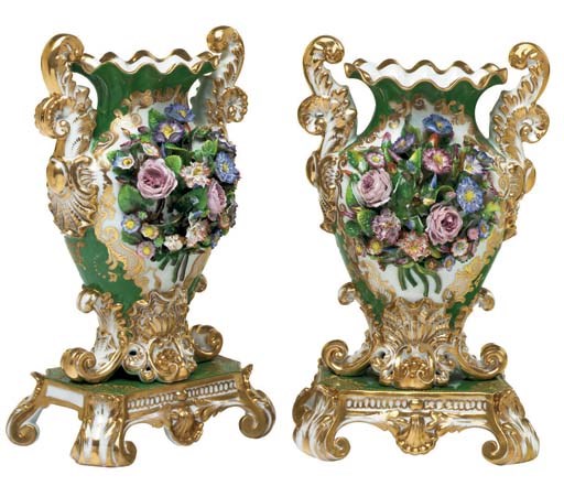 A PAIR OF JACOB PETIT TWO-HANDLED GREEN-GROUND FLOWER-ENCRUSTED TWO-HANDLED VASES ON FIXED STANDS