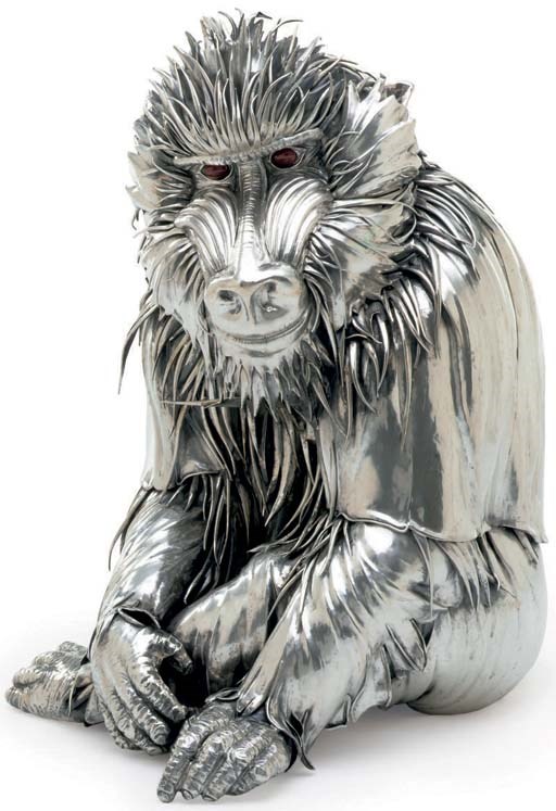 A SILVER FIGURE OF A MANDRILL