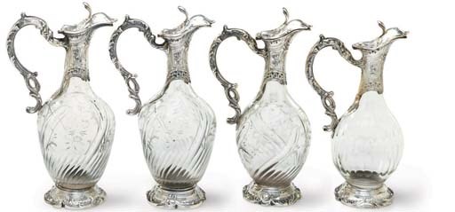 FOUR FRENCH SILVER-MOUNTED GLASS CLARET JUGS
