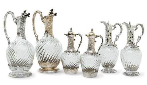 A GROUP OF SIX FRENCH SILVER-MOUNTED GLASS CLARET JUGS