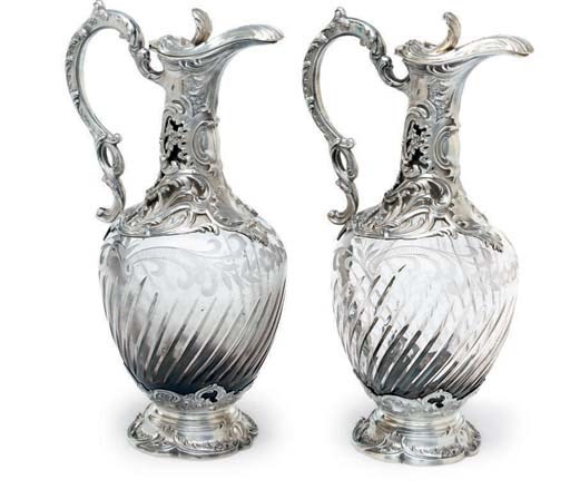 A PAIR OF FRENCH SILVER-MOUNTED CUT-GLASS CLARET JUGS