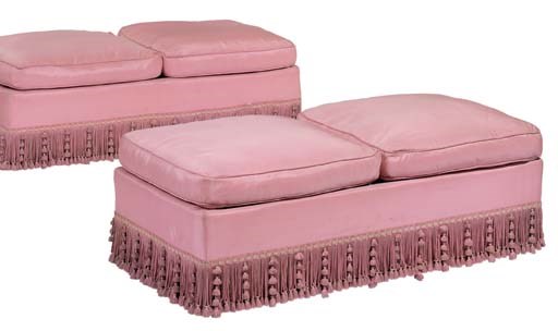 A PAIR OF PINK SILK UPHOLSTERED OTTOMANS