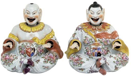 A PAIR OF CONTINENTAL PORCELAIN ARMORIAL ARTICULATED NODDING-HEAD PAGODA FIGURES