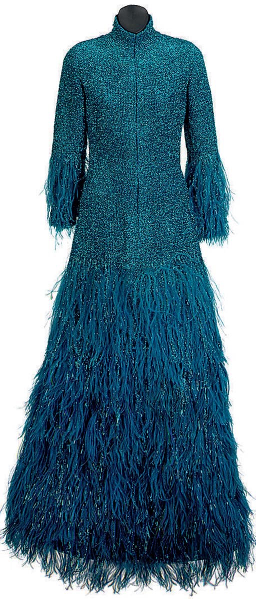 A TURQUOISE BLUE METALLIC KNIT EVENING DRESS AND OSTRICH FEATHER BOA