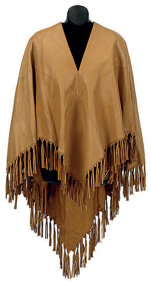 AN HERMÈS SOFT LEATHER TAN PONCHO WITH FRINGE TRIM