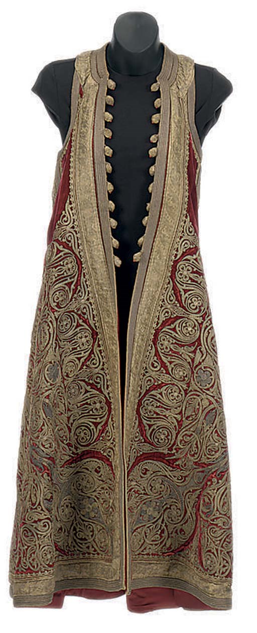 A SURCOAT OF HEAVY METALLIC GOLD EMBROIDERY ON BURGUNDY VELVET