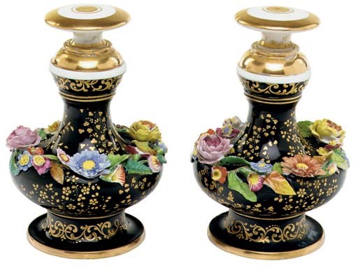 A PAIR OF JACOB PETIT PORCELAIN FLOWER-ENCRUSTED BLACK-GROUND SCENT-BOTTLES AND STOPPERS