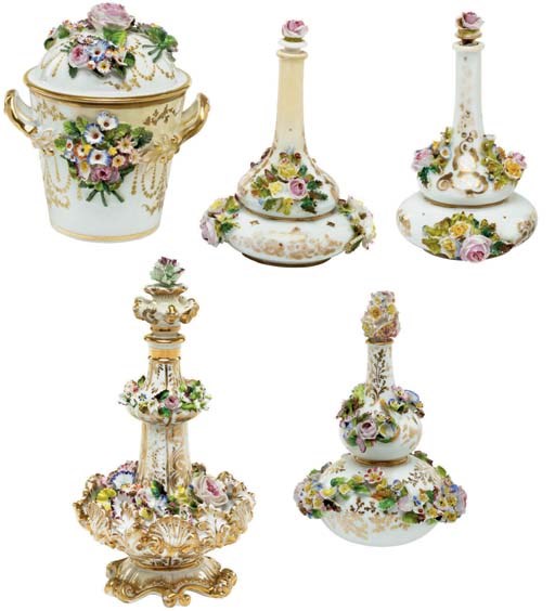 FOUR JACOB PETIT PORCELAIN FLOWER-ENCRUSTED SCENT-BOTTLES AND STOPPERS AND A TWO-HANDLED JAR AND COVER