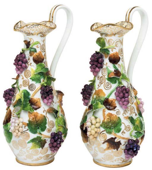 A PAIR OF JACOB PETIT PORCELAIN VINE-ENCRUSTED EWERS