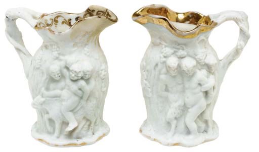 A JACOB PETIT PORCELAIN WINE POT AND A STOPPER AND TWO BISCUIT EWERS
