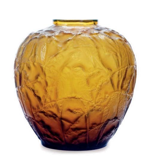 AN AMBER MOLDED GLASS VASE,