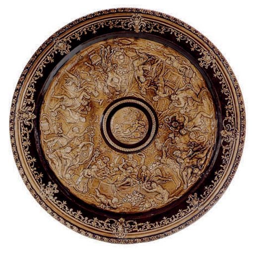 A GERMAN BROWN-GLAZED EARTHEWARE CHARGER,