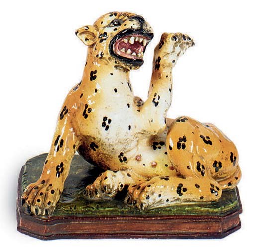 A CERAMIC MODEL OF A SEATED LEOPARD,