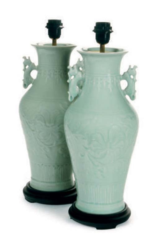 A PAIR OF CELADON TWO-HANDLED BALUSTER VASES MOUNTED AS LAMPS,