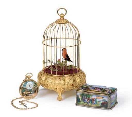 A SMALL EMAMEL BOX AND A GILT-METAL CAGE BOTH WITH SINGING BIRDS,