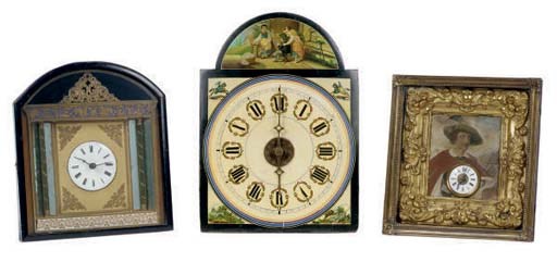 A GROUP OF THREE CONTINENTAL 'WAG AT THE WA' WALL CLOCKS,
