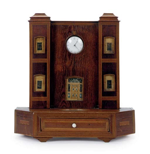 A MIXED WOOD ARCHITECTURAL FORM POCKET WATCH STAND WITH DRAWER,