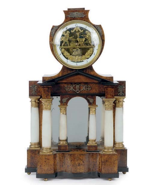 A NORTH EUROPEAN WALNUT AND ALABASTER PILLAR CLOCK,