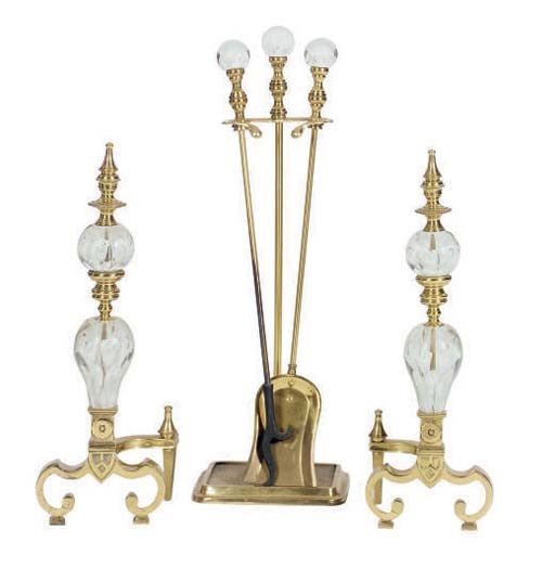 A PAIR OF BRASS AND GLASS ANDIRONS,