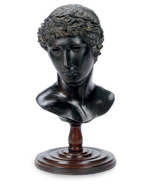 A PATINATED BRONZE BUST OF A YOUTH,