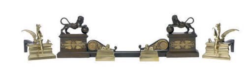 A PAIR OF BRASS ANDIRONS AND A PATINATED METAL FENDER,