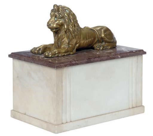A STONE AND MARBLE BOX SURMOUNTED BY A GILT-METAL LION,