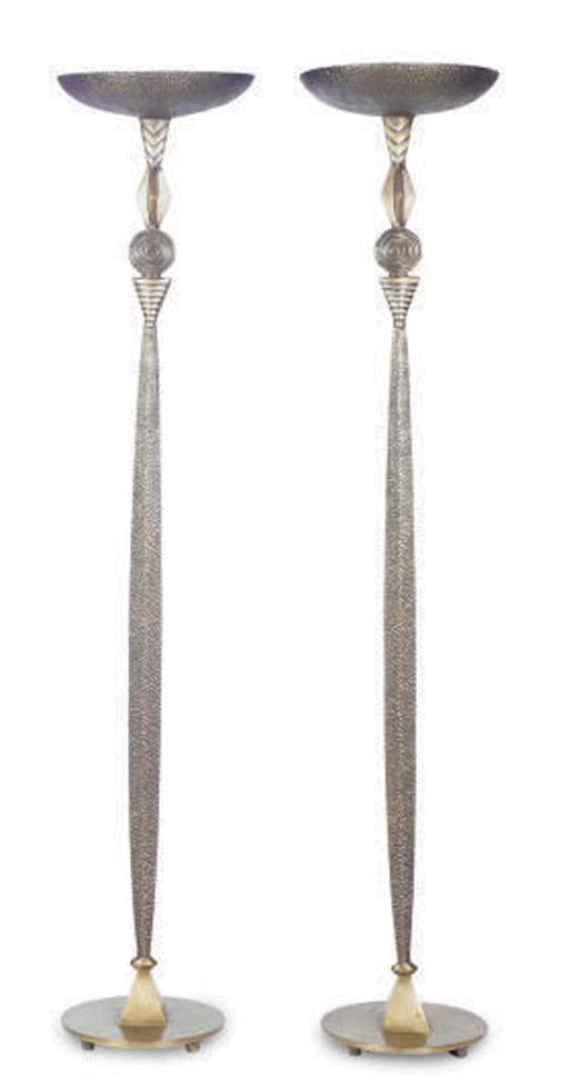 A PAIR OF PATINATED BRONZE TORCHERES,