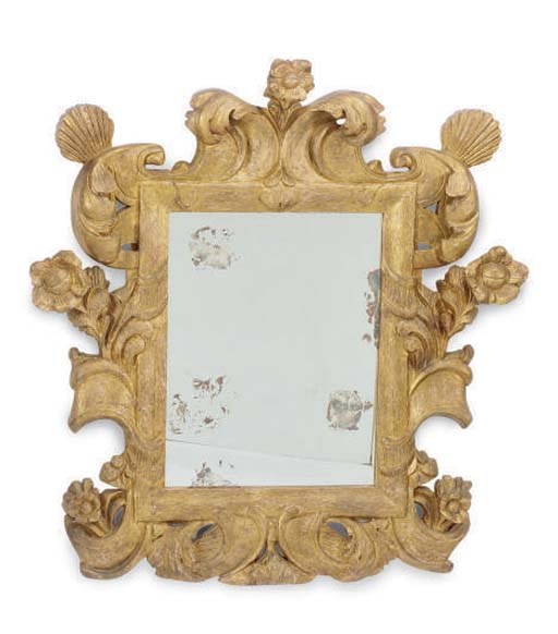A GILT COMPOSITION WALL MIRROR,
