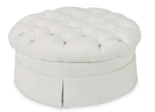 A BUTTON TUFTED CIRCULAR POOF,