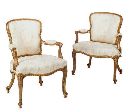 A PAIR OF CARVED GILTWOOD OPEN ARMCHAIRS,