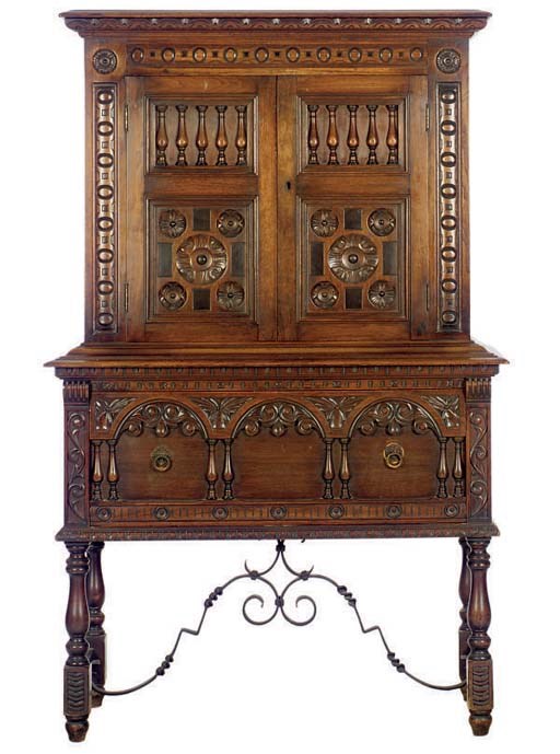 A CARVED OAK AND WROUGHT IRON BUFFET,