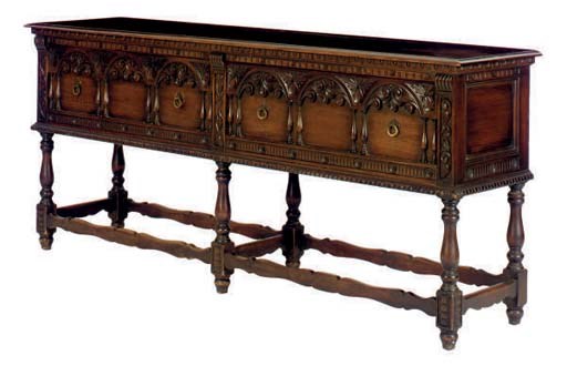 A CARVED OAK SIDEBOARD,