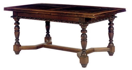 A CARVED OAK DINING TABLE,