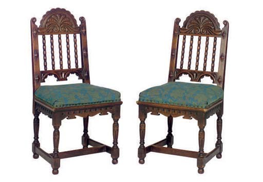 A SET OF FOUR CARVED OAK DINING CHAIRS,