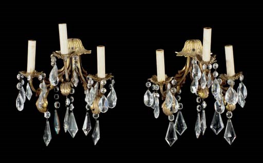A SET OF FOUR THREE-BRANCH GILT-METAL AND CUT GLASS WALL SCONCES,