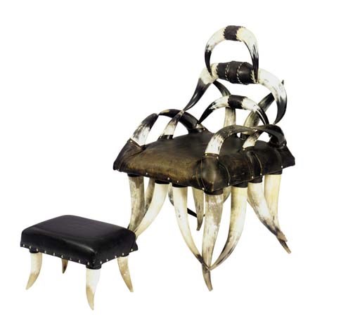 A HORN AND BLACK LEATHER UPHOLSTERED ARMCHAIR,