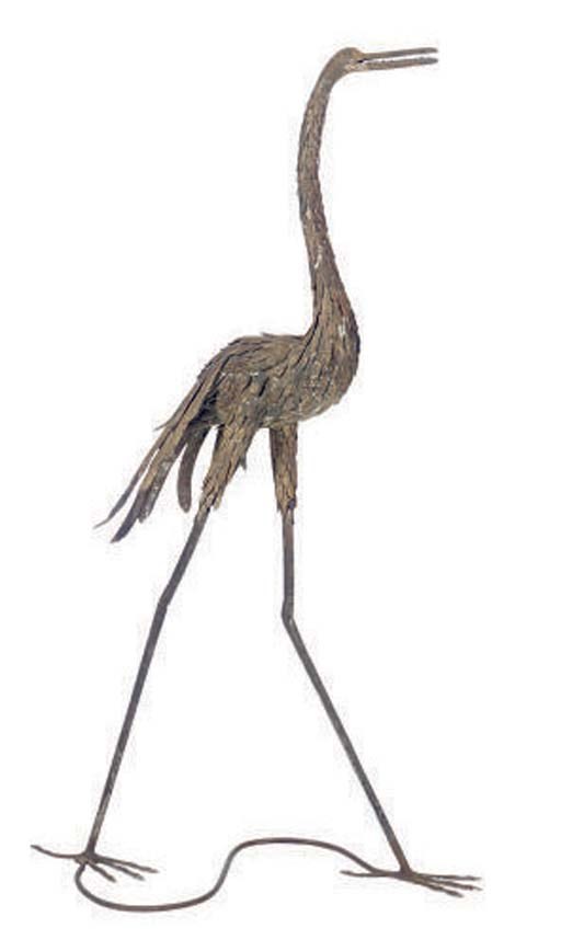 A PATINATED METAL FIGURE OF A STORK,