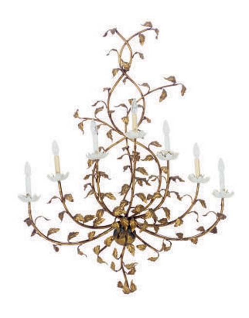 A GILT-METAL FLORAL FORM SEVEN-LIGHT WALL LIGHT,