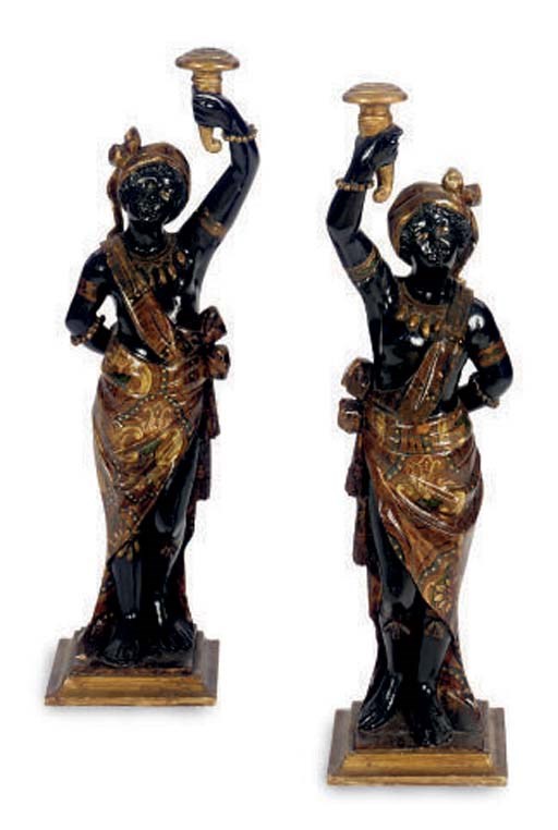 A PAIR OF POLYCHROME PAINTED BLACKAMOOR CANDLESTICKS,