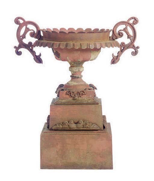 A RED PAINTED CAST IRON GARDEN URN,