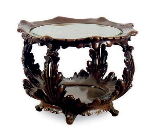 A CARVED HARDWOOD REVOLVING LOW TABLE WITH ETCHED GLASS TOP,