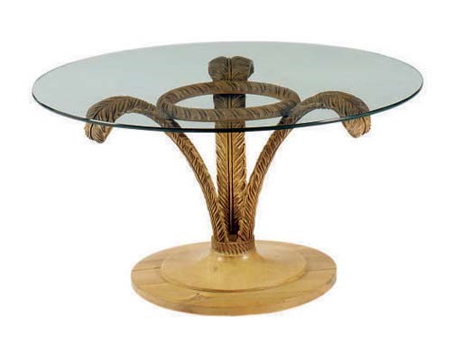 A FLORAL CARVED FRUITWOOD GLASS TOPPED LOW TABLE,